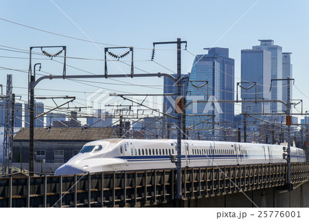 名古屋都市風景 枇杷島町から名古屋駅ビルと東海道新幹線 N700a系を望むの写真素材