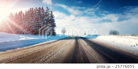 Asphalt road in snowy winter on beautiful sunny Asphalt road in snowy winter on beautiful sunny 25776055