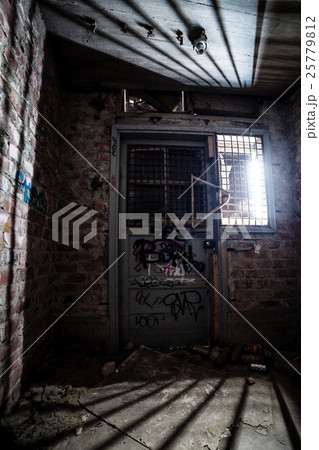 Closed door at abandoned factory 25779812
