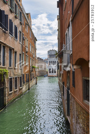 Venice cityscape. Narrow canal among old colorful  25783912