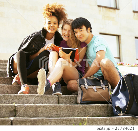 cute group teenages at the building of university cute group teenages at the building of university 25784621