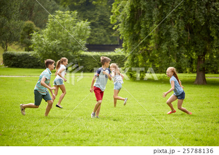 happy kids running and playing game outdoors happy kids running and playing game outdoors 25788136