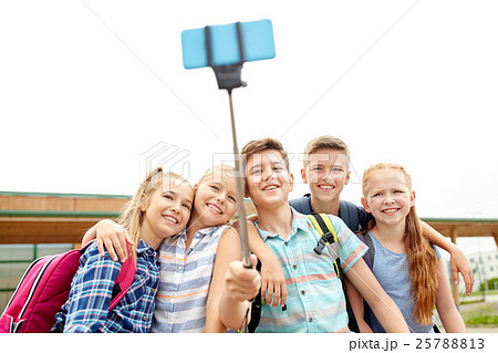 happy elementary school students taking selfie happy elementary school students taking selfie 25788813