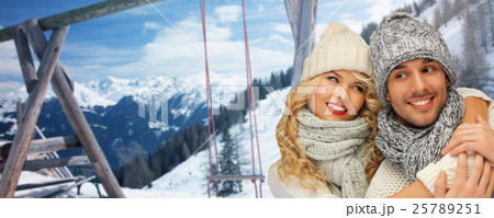 happy family couple in winter clothes hugging 25789251