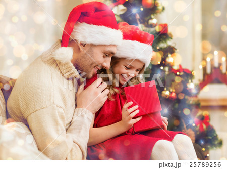 smiling father and daughter opening gift box smiling father and daughter opening gift box 25789256