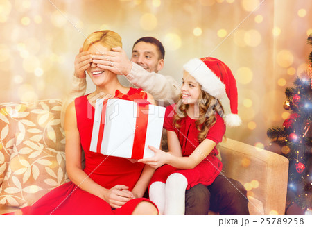 father and daughter surprise mother with gift box father and daughter surprise mother with gift box 25789258