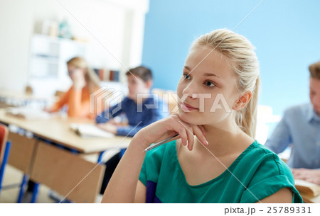 happy student girl at school lesson 25789331
