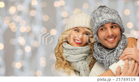 happy family couple in winter clothes hugging happy family couple in winter clothes hugging 25789519