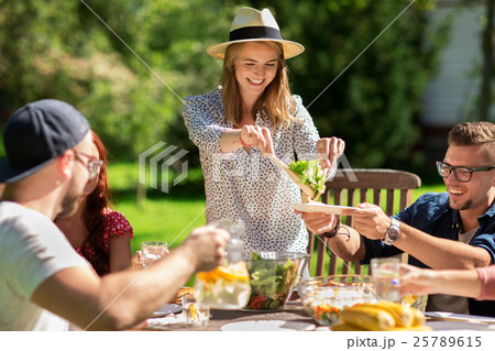 happy friends having dinner at summer garden party happy friends having dinner at summer garden party 25789615