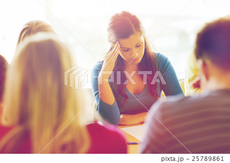 group of students with papers 25789861