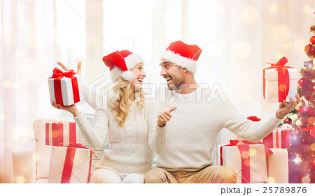 happy couple with christmas gifts and thumbs up happy couple with christmas gifts and thumbs up 25789876
