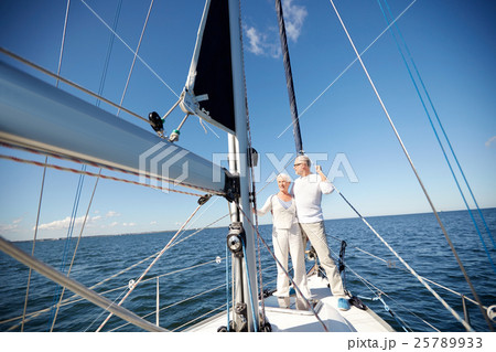 senior couple hugging on sail boat or yacht in sea 25789933