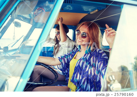 smiling young hippie women driving minivan car smiling young hippie women driving minivan car 25790160