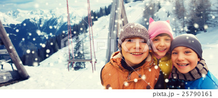happy children hugging over winter background happy children hugging over winter background 25790161