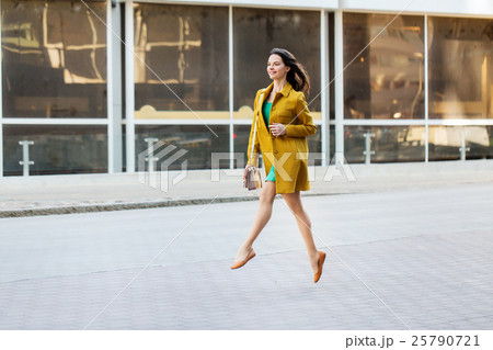 happy young woman or teenage girl on city street 25790721