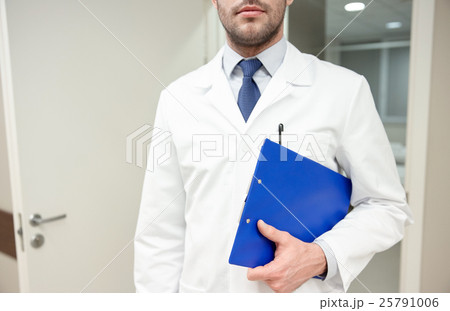 close up of doctor with clipboard at hospital 25791006