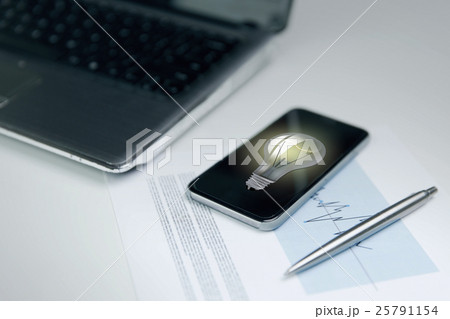 close up of smartphone with lightbulb on screen close up of smartphone with lightbulb on screen 25791154