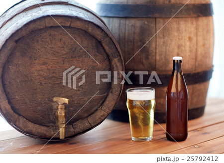 close up of old beer barrel, glass and bottle 25792412