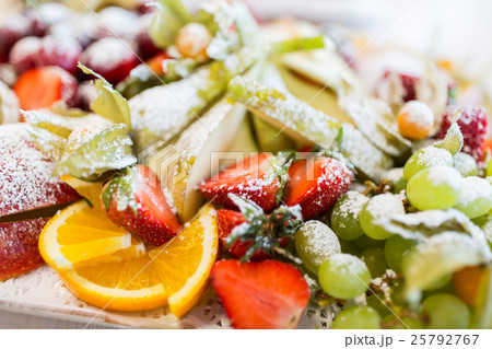 close up of dish with sugared fruit dessert 25792767