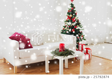 sofa, table and christmas tree with gifts at home sofa, table and christmas tree with gifts at home 25792874