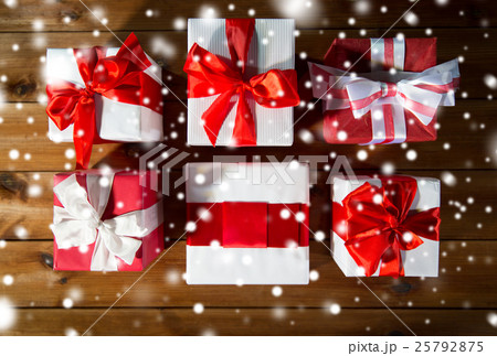 close up of gift boxes on wooden floor from top 25792875