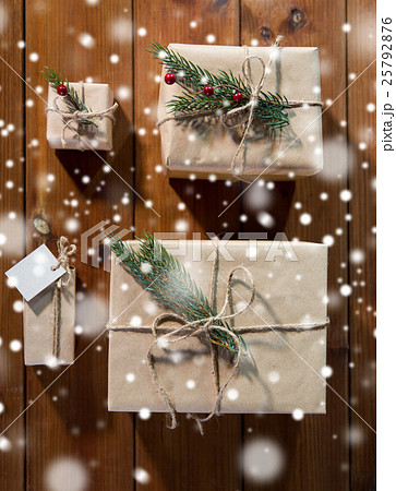 close up of christmas gifts with fir brunch close up of christmas gifts with fir brunch 25792876