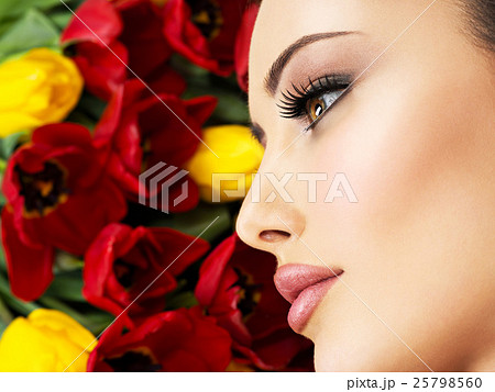 Closeup face of the young woman with flowers. Closeup face of the young woman with flowers. 25798560