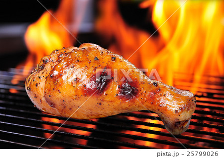 Grilled chicken leg on the flaming grill 25799026