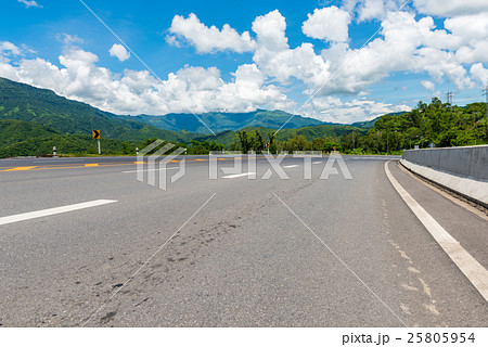 Winding Paved Road with blue sky in the mountain. 25805954
