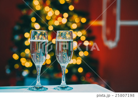 Beautiful two glasses of champagne standing  25807198