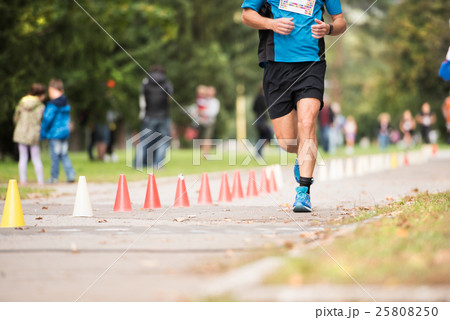 Unrecognizable runner outdoors. Long distance Unrecognizable runner outdoors. Long distance 25808250