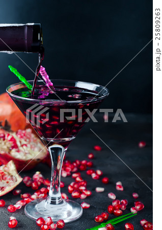 Pouring drink into a glass Pouring drink into a glass 25809263