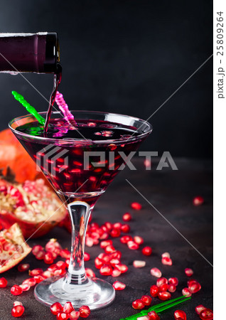 Pouring drink into a glass Pouring drink into a glass 25809264