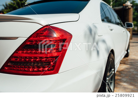 Beautiful white car parked near house Beautiful white car parked near house 25809921