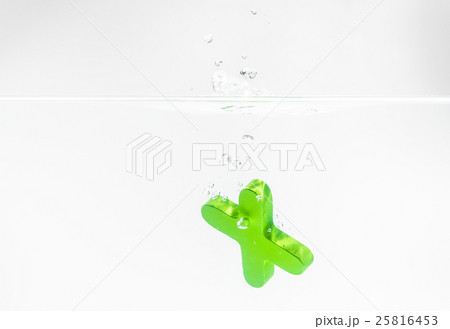 Green wooden alphabet X drop in the water 25816453