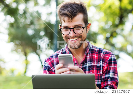 Young Man Using Browsing Smartphone Concept Young Man Using Browsing Smartphone Concept 25817907
