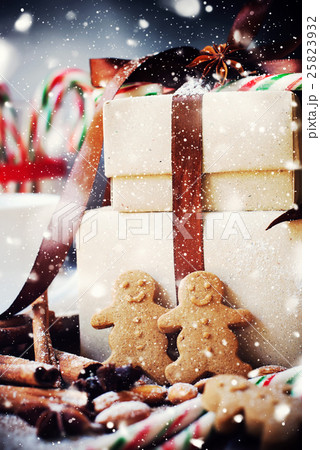 Gingerbread Men near with Boxes on Christmas Table 25823932