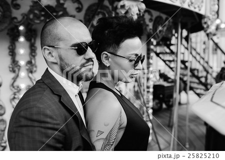 adult man and woman on a carousel 25825210