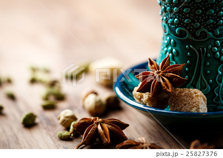 Hot drink with spices in authentic cup 25827376