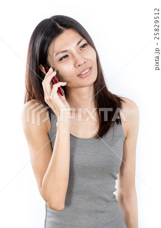 Asian woman talking on smartphone Asian woman talking on smartphone 25829512