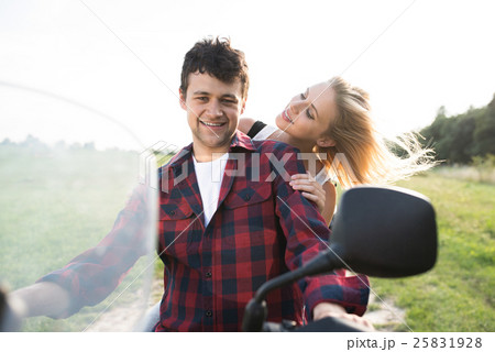 Couple in love enjoying a quad bike ride in Couple in love enjoying a quad bike ride in 25831928