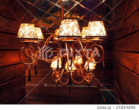 Vintage chandelier with light bulbs.  25834886