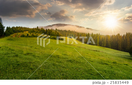 fog around the mountain top at sunset fog around the mountain top at sunset 25835449