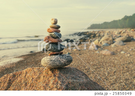 Sustainable cairn at sea in pastel colors 25850349