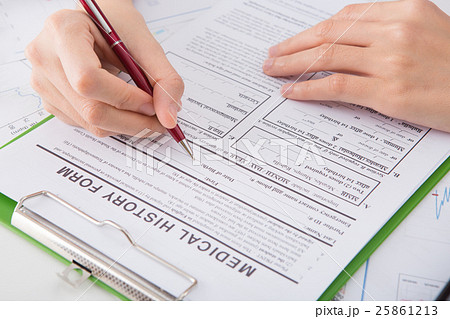 Hands of medical doctor writing on a clipboard Hands of medical doctor writing on a clipboard 25861213
