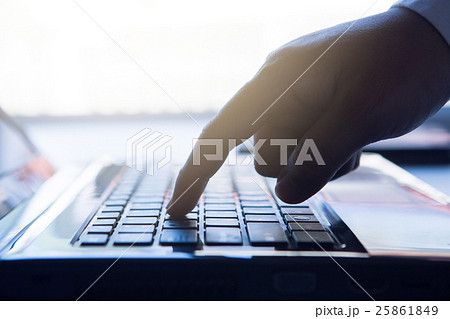 finger holding to phone on keyboard 25861849