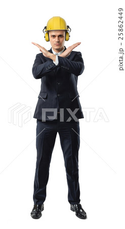 Businessman full height wearing yellow helmet with 25862449