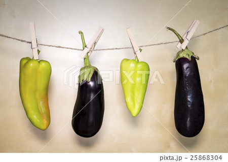 Eggplant And Paprika On Wooden Background Eggplant And Paprika On Wooden Background 25868304