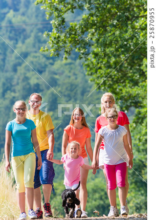 Family having walk on path in the woods Family having walk on path in the woods 25870955