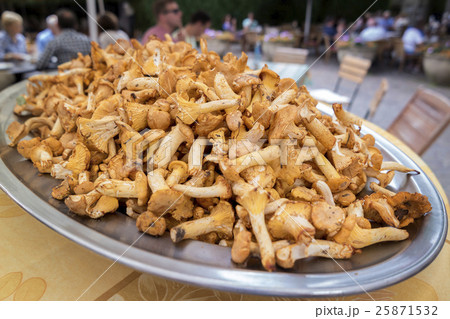 Big pile of chanterelles on a platter Big pile of chanterelles on a platter 25871532